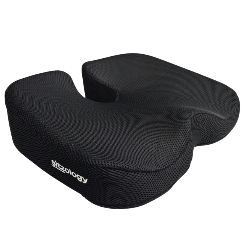 A black cushion designed for ergonomic support, featuring a textured surface and a cutout in the center for seating.
